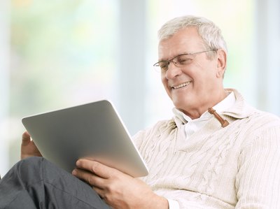 Man researching on digital tablet
