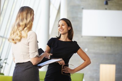 co-workers talking at work