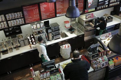 Starbucks employees work behind the counter in Washington D.C.
