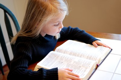 Girl reading the bible