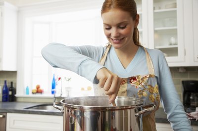 Woman stirs pot