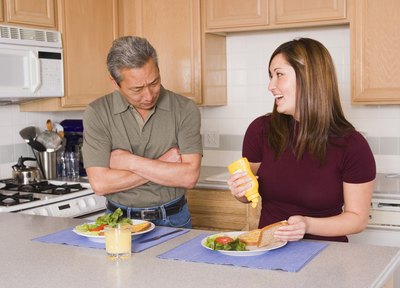 couple eating sandwiches a couple hours before bed