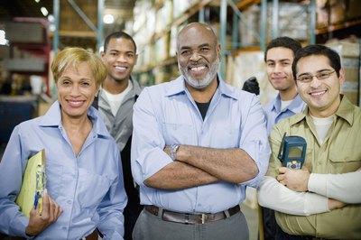 A group of happy employees in a warehouse.