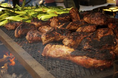 Tri tip steaks and corn on wood fired BBQ