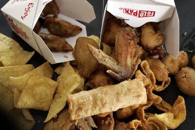 Chinese foods including fried chicken wings, fried wonton, fried rice, fried egg roll, and fried dumplings