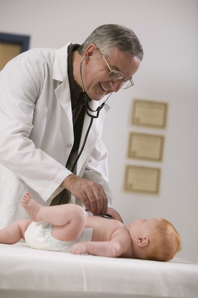 Doctor examining an infant