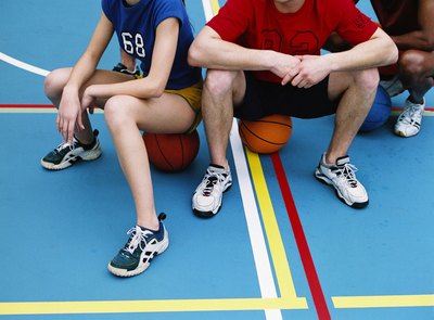 Friends resting during basketball game