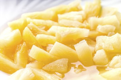 Canned pineapple chunks on plate.