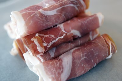 Prosciutto wraps with cheese in center
