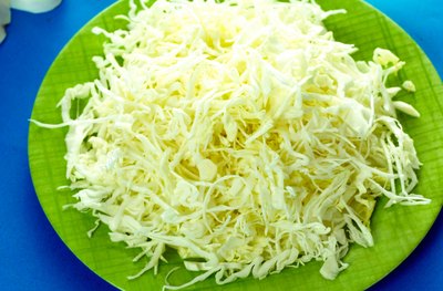 A plate of shredded iceberg lettuce.