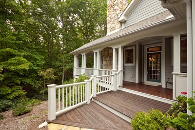A porch or deck can make your doorway look more visually appealing.