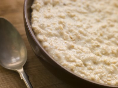 Porridge is regularly served out of three-legged community cooking pots in Zulu villages
