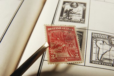 Stamp being placed in collector's book