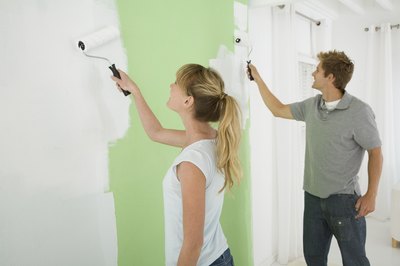 couple painting the wall
