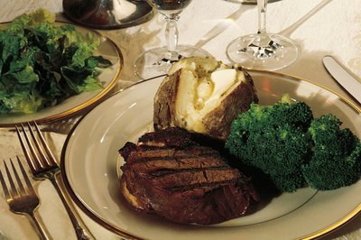 Serve a family-style meal with steak and baked potatoes.