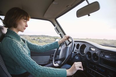Young woman driving car