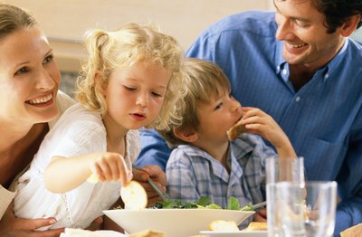 children eating a healthy dinner with parents