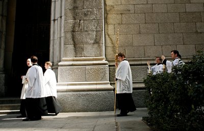 Clergymen walk past St. Patrick's church in New York.