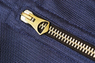 A close-up of a metal zipper.