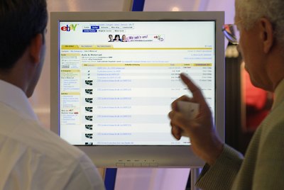 Men looking at Ebay webpage