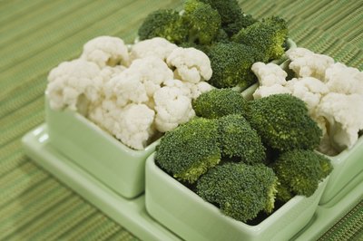 Small dishes of broccoli and cauliflower