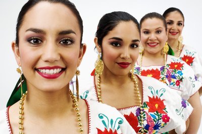 Women wearing chain necklaces.