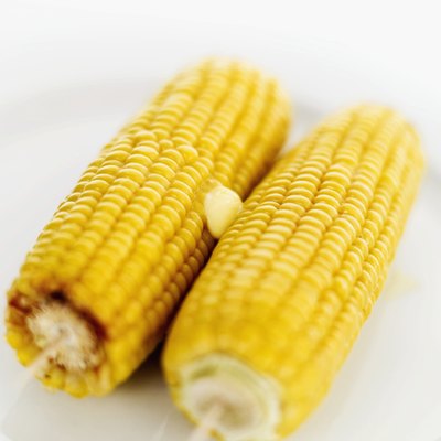 A plate of sweet corn with butter.