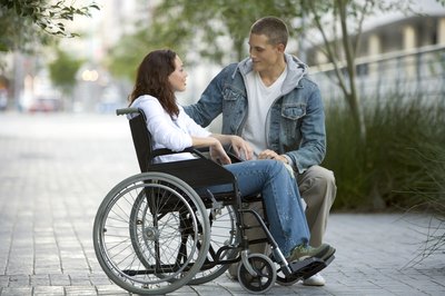 Woman in wheel chair talking to boyfriend