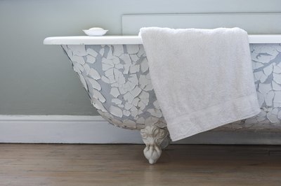 Towel laying on side of tub