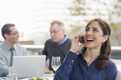 woman listening to singing telegram by phone