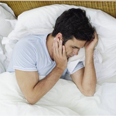 Man waking up due to pain