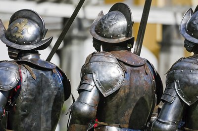 Medieval royal armoured guardsmen with Fleur-de-lis symbol on helmets