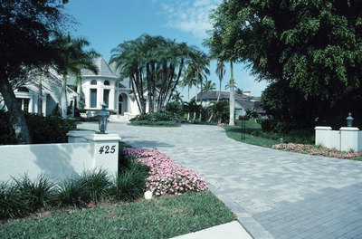 Flowering trees can add color and texture to the driveway entrance.