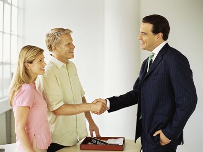 business shaking client's hand