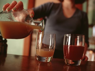woman pouring vintage themed drinks
