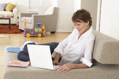 Woman smiling on laptop