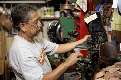 Cobbler working on shoe