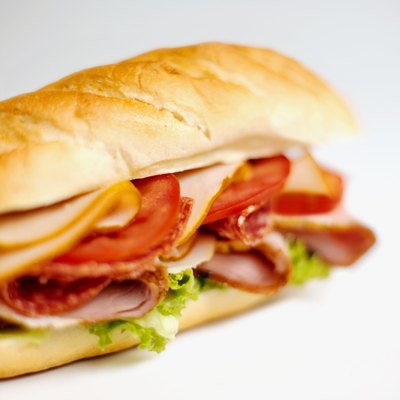 A close up of a ham and cheese sandwich.