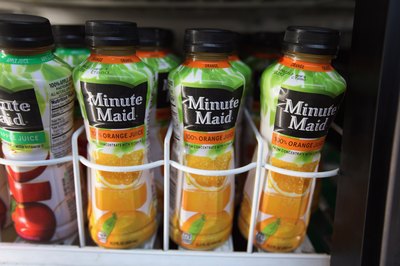 Minute Maid orange juice drink on store shelf