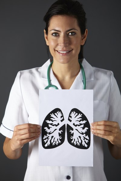 Nurse holds picture of lungs