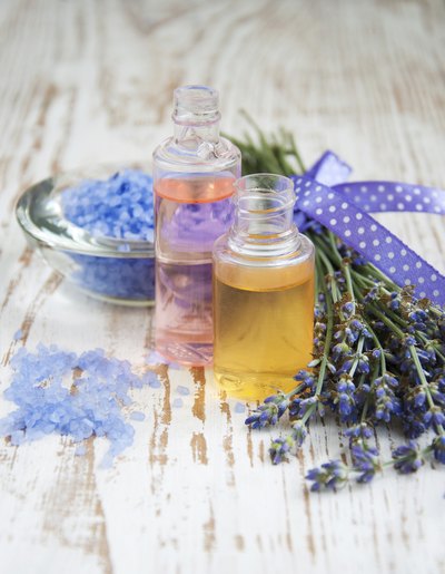 Homemade beauty products on a table with fresh lavender.