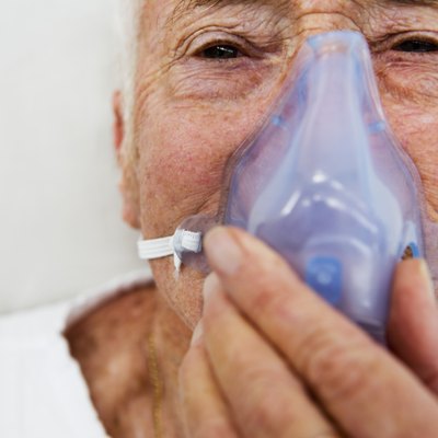 Older man with a plastic breathing mask