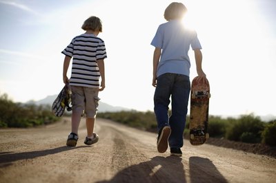 Adolescent boys skateboarding