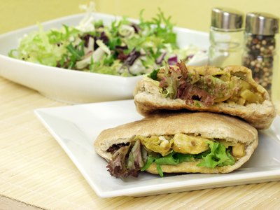 Pita bread sandwich and salad.