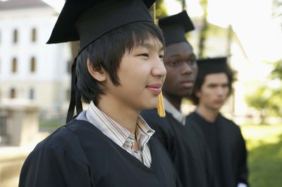 A graduate wears a yellow tassle.
