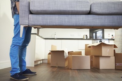 Man lifting couch