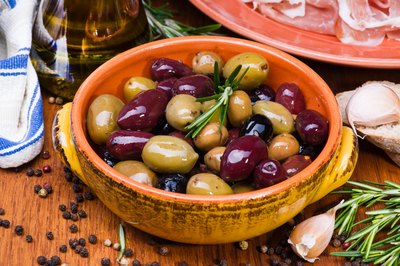 Bowl of mixed olives with rosemary