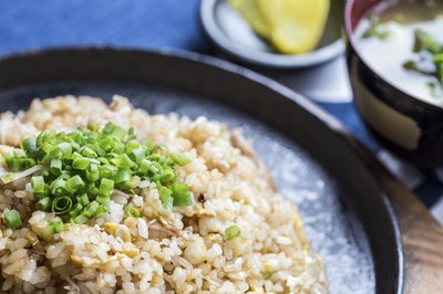 Garnish egg fried rice with cilantro.
