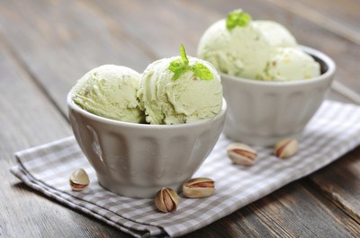 Two bowls of pistachio ice cream.