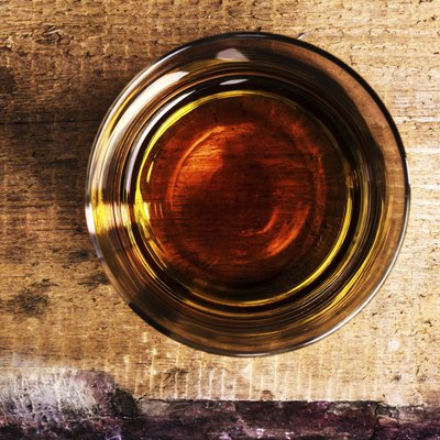 Top view of a shot of whiskey on counter